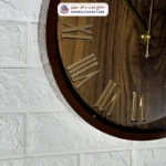 ساعت دیواری چوبی ولدر پس زمینه طرح چوب